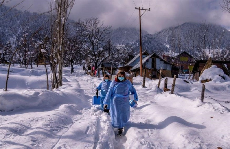 In Kashmir, health workers walk up the Himalayan mountains to vaccinate residents.